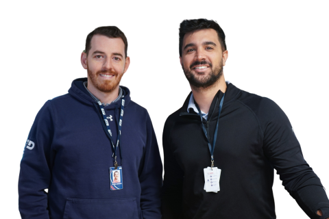 two associates smiling at the camera